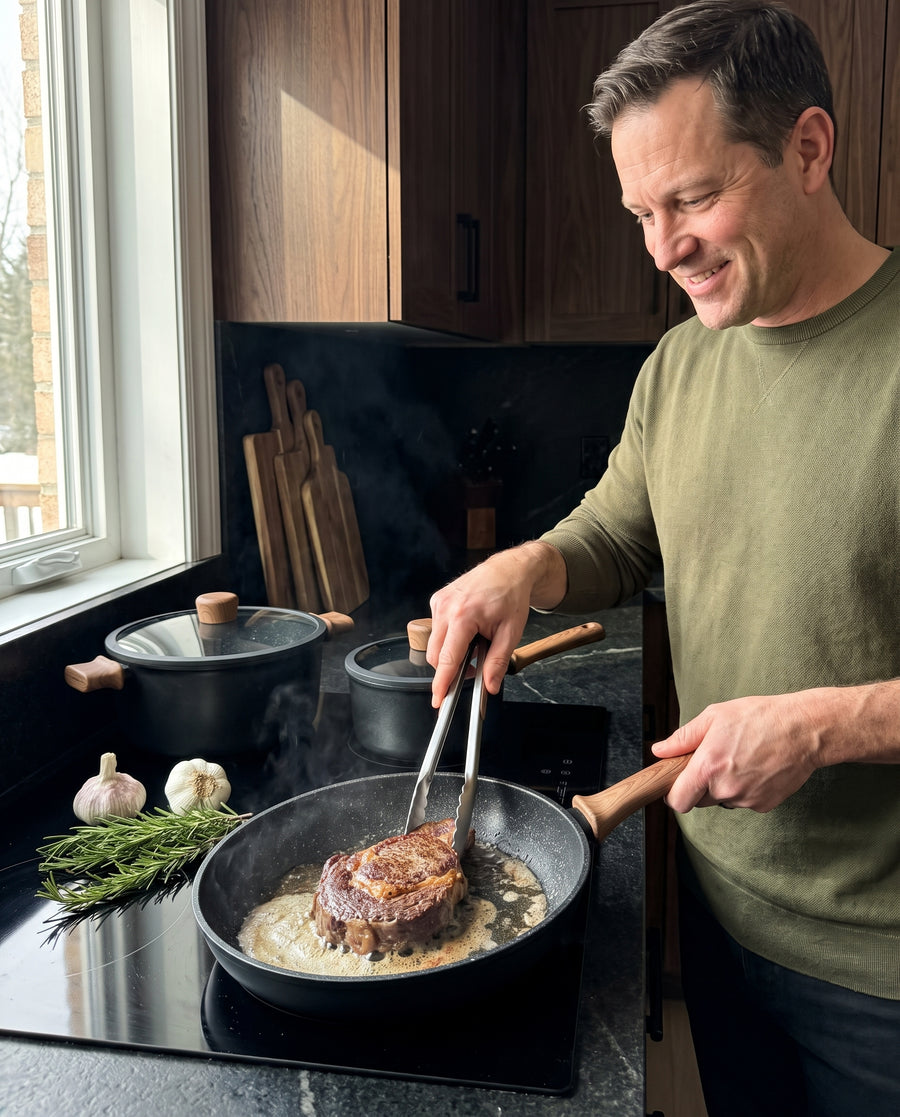 A steak searing in the black frying pan on an induction hob
