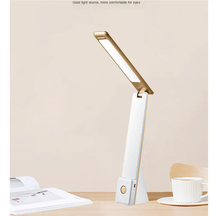 Portable LED desk lamp on a desk