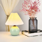 Small ceramic bedside lamp styled on a side table