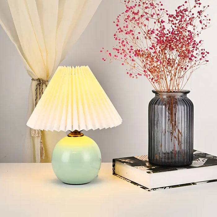 Small ceramic bedside lamp styled on a side table
