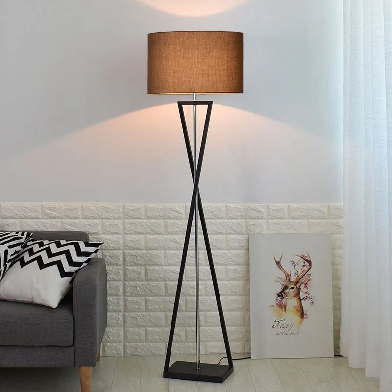 Drum shade standing lamp on a twisted metal base