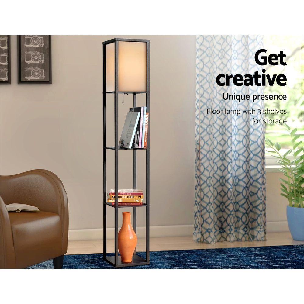 Three open display shelves under the fabric shade